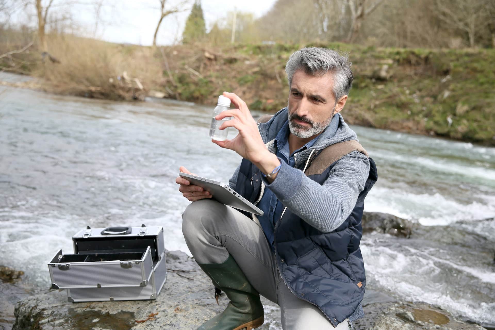 man testing contaminated water